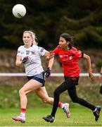 25 July 2023; Kathryn Snell of Heartland and Hak Sreypov of Cairde Khmer Cambodia during day two of the FRS Recruitment GAA World Games 2023 at the Owenbeg Centre of Excellence in Dungiven, Derry. Photo by Ramsey Cardy/Sportsfile