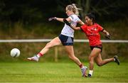 25 July 2023; Kathryn Snell of Heartland and Soeun Sreytoch of Cairde Khmer Cambodia during day two of the FRS Recruitment GAA World Games 2023 at the Owenbeg Centre of Excellence in Dungiven, Derry. Photo by Ramsey Cardy/Sportsfile