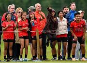 25 July 2023; Cairde Khmer Cambodia ladies footballers react while watching the Cairde Khmer Cambodia mens team during day two of the FRS Recruitment GAA World Games 2023 at the Owenbeg Centre of Excellence in Dungiven, Derry. Photo by Ramsey Cardy/Sportsfile