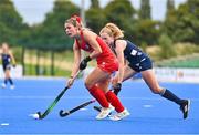 25 July 2023; Doménica Ananías of Chile in action against Niamh Carey of Ireland during the women's hockey international match between Ireland and Chile at the Sport Ireland Campus in Dublin. Photo by Ben McShane/Sportsfile