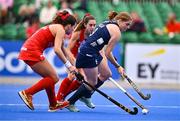 25 July 2023; Kathryn Mullan of Ireland in action against Fernanda Villagrán Verdaguer, left, and Camila Caram of Chile during the women's hockey international match between Ireland and Chile at the Sport Ireland Campus in Dublin. Photo by Ben McShane/Sportsfile