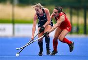 25 July 2023; Sarah Hawkshaw of Ireland in action against Josefina Khamis of Chile during the women's hockey international match between Ireland and Chile at the Sport Ireland Campus in Dublin. Photo by Ben McShane/Sportsfile
