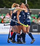 25 July 2023; Elena Tice of Ireland celebrates with Niamh Carey, behind, and Ellen Curran, right, after scoring their side's first goal during the women's hockey international match between Ireland and Chile at the Sport Ireland Campus in Dublin. Photo by Ben McShane/Sportsfile