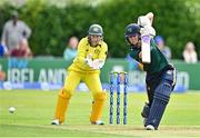 25 July 2023; Gaby Lewis of Ireland bats as Australia wicket keeper Alyssa Healy watches on during match two of the Certa Women’s One Day International Challenge between Ireland and Australia at Castle Avenue in Dublin. Photo by Sam Barnes/Sportsfile