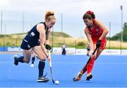 25 July 2023; Michelle Carey of Ireland and Denise Krimerman Losada of Chile during the women's hockey international match between Ireland and Chile at the Sport Ireland Campus in Dublin. Photo by Ben McShane/Sportsfile