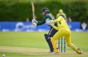 25 July 2023; Cara Murray of Ireland bats as Australia wicketkeeper Alyssa Healy watches on during match two of the Certa Women’s One Day International Challenge between Ireland and Australia at Castle Avenue in Dublin. Photo by Sam Barnes/Sportsfile