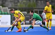 25 July 2023; Vitalii Shevchuk of Ukraine in action against Nicholas Page, hidden, and Sean Murray of Ireland during the Men's EuroHockey Championship Qualifier match between Ireland and Ukraine at the Sport Ireland Campus in Dublin. Photo by Ben McShane/Sportsfile
