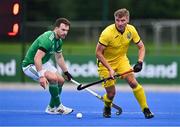 25 July 2023; Olekandr Diachenko of Ukraine in action against Jeremy Duncan of Ireland during the Men's EuroHockey Championship Qualifier match between Ireland and Ukraine at the Sport Ireland Campus in Dublin. Photo by Ben McShane/Sportsfile