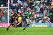 23 July 2023; Oisin Fitzgerald, Gaelscoil Mhichil Cosóg, Inis, An Clár, representing Limerick in action against James Walsh, St Laurence's NS, Blackrock, Ath Cliath, representing Kilkenny and Fionn Delaney, Holy Family Senior, Portlaoise, Laois, representing Kilkenny, left, during the INTO Cumann na mBunscol GAA Respect Exhibition Go Games at the GAA Hurling All-Ireland Senior Championship final match between Kilkenny and Limerick at Croke Park in Dublin. Photo by Ray McManus/Sportsfile
