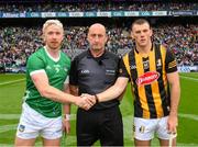 23 July 2023; The two captains, Cian Lynch of Limerick, and Eoin Cody of Kilkenny, shake hands across match referee John Keenan before the GAA Hurling All-Ireland Senior Championship final match between Kilkenny and Limerick at Croke Park in Dublin. Photo by Ray McManus/Sportsfile