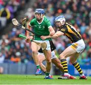 23 July 2023; David Reidy of Limerick is tackled by TJ Reid and Richie Reid of Kilkenny, hidden, during the GAA Hurling All-Ireland Senior Championship final match between Kilkenny and Limerick at Croke Park in Dublin. Photo by Ray McManus/Sportsfile