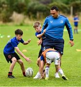 26 July 2023; Leinster player Charlie Ngatai with participants during the Bank of Ireland Leinster Rugby Summer Camp at Carlingford RFC in Louth. Photo by Ben McShane/Sportsfile