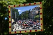 27 July 2023; Cyclists are seen reflected off a traffic mirror in the boys road race final during day four of the 2023 Summer European Youth Olympic Festival in Maribor, Slovenia. Photo by Tyler Miller/Sportsfile