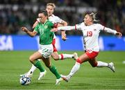 26 July 2023; Katie McCabe of Republic of Ireland is tackled by Adriana Leon of Canada during the FIFA Women's World Cup 2023 Group B match between Canada and Republic of Ireland at Perth Rectangular Stadium in Perth, Australia. Photo by Stephen McCarthy/Sportsfile