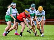 27 July 2023; Amy Banville of Asia in action against Britain 1 players, from left, Becky Ryan, 4, and Annie Driver, 3, during day four of the FRS Recruitment GAA World Games 2023 at the Owenbeg Centre of Excellence in Dungiven, Derry. Photo by Piaras Ó Mídheach/Sportsfile