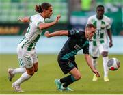 27 July 2023; Liam Burt of Shamrock Rovers in action against Cebrails Makreckis of Ferencvaros during the UEFA Europa Conference League Second Qualifying Round First Leg match between Ferencvaros and Shamrock Rovers at Ferencváros Stadion in Budapest, Hungary. Photo by David Balogh/Sportsfile