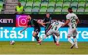 27 July 2023; Richie Towell of Shamrock Rovers in action against Mohammad Abu Fani of Ferencvaros during the UEFA Europa Conference League Second Qualifying Round First Leg match between Ferencvaros and Shamrock Rovers at Ferencváros Stadion in Budapest, Hungary. Photo by David Balogh/Sportsfile