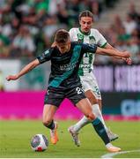 27 July 2023; Johnny Kenny of Shamrock Rovers in action against Cebrails Makreckis of Ferencvaros during the UEFA Europa Conference League Second Qualifying Round First Leg match between Ferencvaros and Shamrock Rovers at Ferencváros Stadion in Budapest, Hungary. Photo by David Balogh/Sportsfile