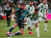 27 July 2023; Ronan Finn of Shamrock Rovers in action against Cristian Ramirez of Ferencvaros during the UEFA Europa Conference League Second Qualifying Round First Leg match between Ferencvaros and Shamrock Rovers at Ferencváros Stadion in Budapest, Hungary. Photo by David Balogh/Sportsfile