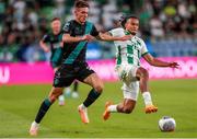 27 July 2023; Johnny Kenny of Shamrock Rovers in action against Samy Mmaee of Ferencvaros during the UEFA Europa Conference League Second Qualifying Round First Leg match between Ferencvaros and Shamrock Rovers at Ferencváros Stadion in Budapest, Hungary. Photo by David Balogh/Sportsfile