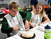 27 July 2023; Michael Kent of Team Ireland is presented with a cake on his 16th birthday by Sports Services Manager Mark MacNamee during day four of the 2023 Summer European Youth Olympic Festival at the Athletes Village in Maribor, Slovenia. Photo by Tyler Miller/Sportsfile