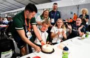 27 July 2023; Michael Kent of Team Ireland is presented with a cake on his 16th birthday by Sports Services Manager Mark MacNamee during day four of the 2023 Summer European Youth Olympic Festival at the Athletes Village in Maribor, Slovenia. Photo by Tyler Miller/Sportsfile