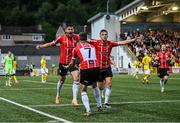 27 July 2023; Cian Kavanagh of Derry City, left, celebrates with teammates Michael Duffy, centre, and Will Patching after scoring their side's second goal during the UEFA Europa Conference League Second Qualifying Round First Leg match between Derry City and KuPS at the Ryan McBride Brandywell Stadium in Derry. Photo by David Fitzgerald/Sportsfile