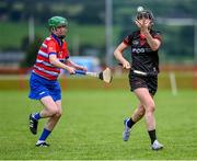 27 July 2023; Alanna Budden of Canada in action against Katrina Terry of USA Warriors during day four of the FRS Recruitment GAA World Games 2023 at the Owenbeg Centre of Excellence in Dungiven, Derry. Photo by Piaras Ó Mídheach/Sportsfile