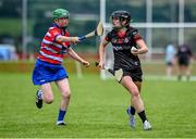 27 July 2023; Alanna Budden of Canada in action against Katrina Terry of USA Warriors during day four of the FRS Recruitment GAA World Games 2023 at the Owenbeg Centre of Excellence in Dungiven, Derry. Photo by Piaras Ó Mídheach/Sportsfile