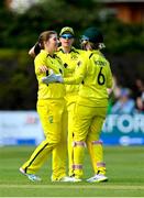 28 July 2023; Australia bowler Georgia Wareham, left, is congratulated by teammate Beth Mooney, right, after claiming the wicket of Ireland's Gaby Lewis during match three of the Certa Women’s One Day International Challenge series between Ireland and Australia at Castle Avenue Cricket Ground in Dublin. Photo by Seb Daly/Sportsfile