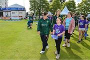 25 July 2023; Ireland captain Laura Delany leads out her team with the mascots before match two of the Certa Women’s One Day International Challenge between Ireland and Australia at Castle Avenue in Dublin. Photo by Sam Barnes/Sportsfile
