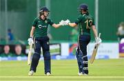 28 July 2023; Ireland batters Orla Prendergast, left, and Rebecca Stokell during match three of the Certa Women’s One Day International Challenge series between Ireland and Australia at Castle Avenue Cricket Ground in Dublin. Photo by Seb Daly/Sportsfile