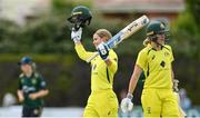 28 July 2023; Phoebe Litchfield of Australia celebrates after bringing up her century of runs during match three of the Certa Women’s One Day International Challenge series between Ireland and Australia at Castle Avenue Cricket Ground in Dublin. Photo by Seb Daly/Sportsfile