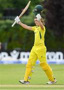 28 July 2023; Annabel Sutherland of Australia celebrates after bringing up her century of runs during match three of the Certa Women’s One Day International Challenge series between Ireland and Australia at Castle Avenue Cricket Ground in Dublin. Photo by Seb Daly/Sportsfile