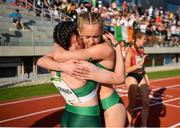 28 July 2023; Amy Jo Kierans of Team Ireland, left, is embraced by teammate Hollie Kilroe after competing in the girl's medley relay during day five of the 2023 Summer European Youth Olympic Festival at Poljane Athletics Stadium in Maribor, Slovenia. Photo by Tyler Miller/Sportsfile