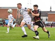 28 July 2023; Jack Keaney of UCD in action against James Clarke of Bohemians during the SSE Airtricity Men's Premier Division match between Bohemians and UCD at Dalymount Park in Dublin. Photo by John Sheridan/Sportsfile