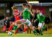 28 July 2023; Harry Wood of Shelbourne is tackled by Barry Coffey of Cork City during the SSE Airtricity Men's Premier Division match between Cork City and Shelbourne at Turner's Cross in Cork. Photo by Eóin Noonan/Sportsfile