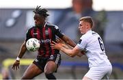 28 July 2023; Jonathan Afolabi of Bohemians in action against Jack Keaney of UCD during the SSE Airtricity Men's Premier Division match between Bohemians and UCD at Dalymount Park in Dublin. Photo by Ramsey Cardy/Sportsfile