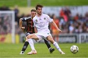 28 July 2023; Daniel Norris of UCD in action against Cian Byrne of Bohemians during the SSE Airtricity Men's Premier Division match between Bohemians and UCD at Dalymount Park in Dublin. Photo by Ramsey Cardy/Sportsfile