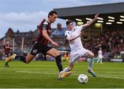 28 July 2023; Dylan Connolly of Bohemians in action against Jesse Dempsey of UCD during the SSE Airtricity Men's Premier Division match between Bohemians and UCD at Dalymount Park in Dublin. Photo by John Sheridan/Sportsfile