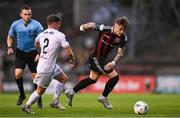 28 July 2023; Danny Grant of Bohemians in action against Michael Gallagher of UCD during the SSE Airtricity Men's Premier Division match between Bohemians and UCD at Dalymount Park in Dublin. Photo by Ramsey Cardy/Sportsfile