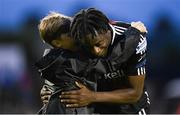 28 July 2023; Double goalscorer Jonathan Afolabi of Bohemians is congratulated by a young supporter after the SSE Airtricity Men's Premier Division match between Bohemians and UCD at Dalymount Park in Dublin. Photo by Ramsey Cardy/Sportsfile