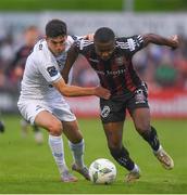 28 July 2023; Brendan Barr of UCD in action against James Akintunde of Bohemians during the SSE Airtricity Men's Premier Division match between Bohemians and UCD at Dalymount Park in Dublin. Photo by John Sheridan/Sportsfile