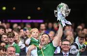 23 July 2023; Limerick player Graeme Mulcahy, with his daughter Róise, lifts the Liam MacCarthy Cup after the GAA Hurling All-Ireland Senior Championship final match between Kilkenny and Limerick at Croke Park in Dublin. Photo by Ramsey Cardy/Sportsfile