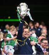 23 July 2023; Limerick selector Paul Kinnerk, with his children Paul, 4 weeks, and Enya, age 4, lifts the Liam MacCarthy Cup after the GAA Hurling All-Ireland Senior Championship final match between Kilkenny and Limerick at Croke Park in Dublin. Photo by Ramsey Cardy/Sportsfile
