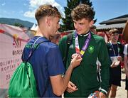 29 July 2023; Cian Crampton of Team Ireland has his bronze medal inspected by teammate Sean Cronin after finishing third in the boys discus throw final during day six of the 2023 Summer European Youth Olympic Festival at Poljane Athletics Stadium in Maribor, Slovenia. Photo by Tyler Miller/Sportsfile