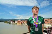 29 July 2023; Conor Murphy of Team Ireland with his time trial Silver medal on the Old Bridge in Maribor during day six of the 2023 Summer European Youth Olympic Festival at in Maribor, Slovenia. Photo by Tyler Miller/Sportsfile