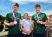 29 July 2023; Conor Murphy of Team Ireland, left, with his time trial Silver medal and teammate Cian Crampton with his discus Bronze medal, right, and Team Ireland Chef De Mission Nancy Chillingworth on the Old Bridge in Maribor during day six of the 2023 Summer European Youth Olympic Festival at in Maribor, Slovenia. Photo by Tyler Miller/Sportsfile