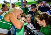 29 July 2023; Sarah Lavin of Emerald AC, Limerick, signs autographs for supporters after winning the women's 100m hurdles during day one of the 123.ie National Senior Outdoor Championships at Morton Stadium in Dublin. Photo by Sam Barnes/Sportsfile
