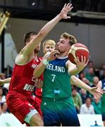 29 July 2023; Sean Flood of Ireland scores a basket despite the close attentions of Mateo Dreznjak of Croatia during the FIBA Men's EuroBasket 2025 Qualifier match between Ireland and Croatia at National Basketball Arena in Dublin. Photo by Brendan Moran/Sportsfile